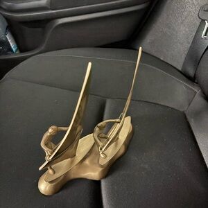 Vintage man and woman windsurfing brass sculpture